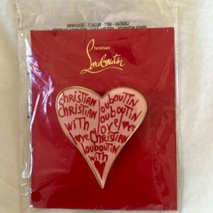 Louboutin brooch
